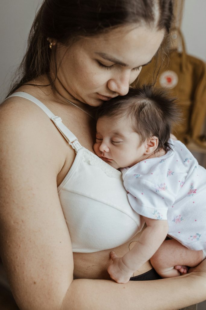 New mother resting at home with her baby