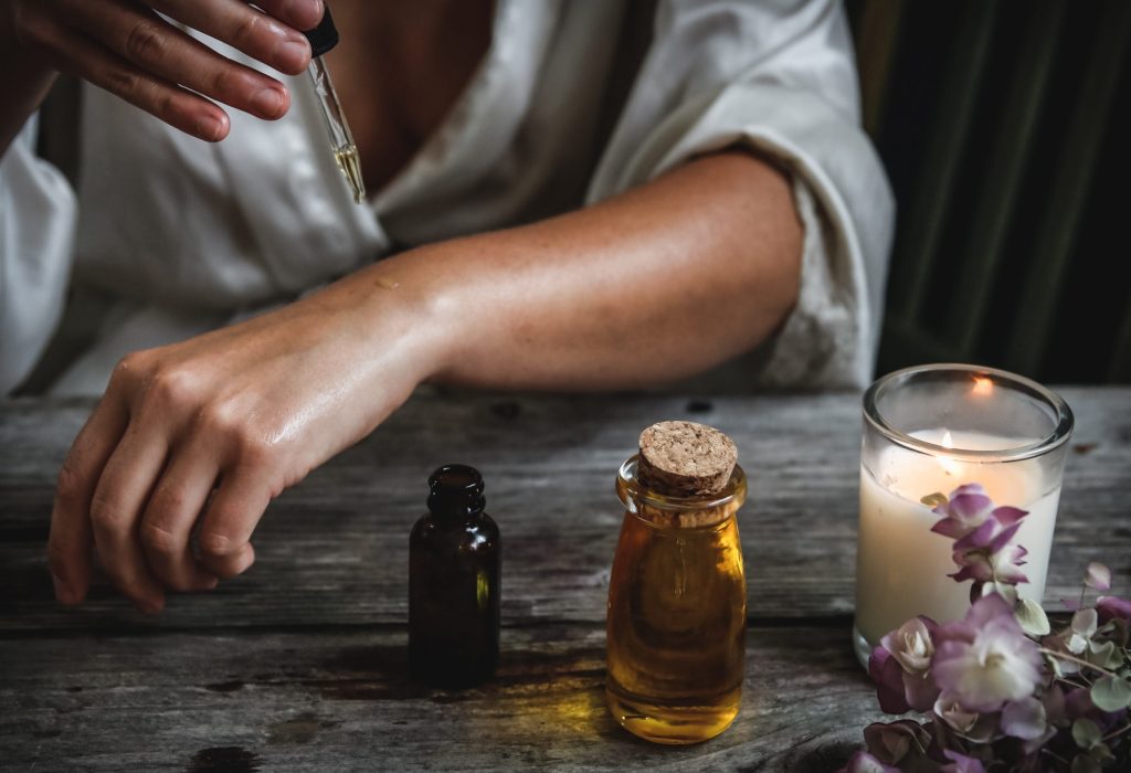 Herbal remedies on a table, symbolising calm and self-care for new mother