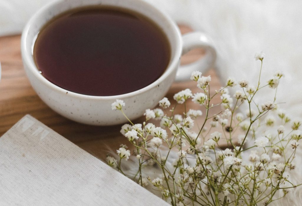 Warm cup of tea, representing nurturing and rest during postpartum recovery